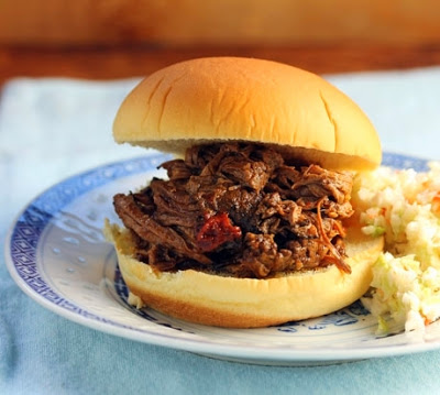 The BEST Slow Cooker Barbecued Beef Sandwiches with Homemade Sauce featured on SlowCookerFromScratch.com