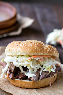 The BEST Slow Cooker Barbecued Beef Sandwiches with Homemade Sauce featured on SlowCookerFromScratch.com