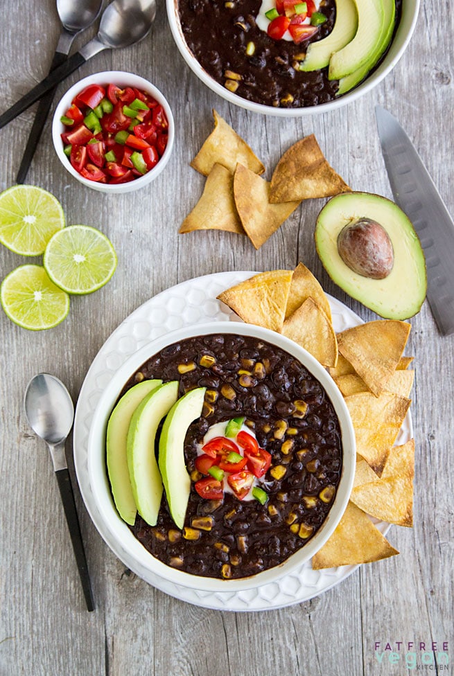 Simple Instant Pot Black Bean Soup from Fat Free Vegan Kitchen finished soup in bowl with garnishes