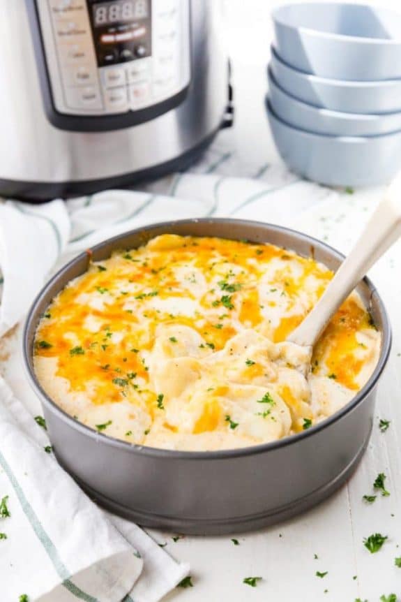 The BEST Instant Pot or Slow Cooker Scalloped Potatoes featured on Slow Cooker or Pressure Cooker at SlowCookerFromScratch.com