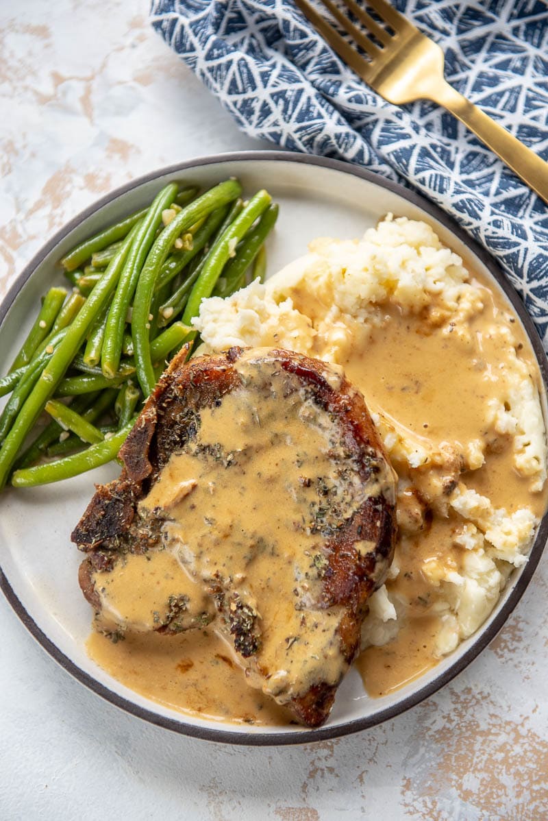 Slow Cooker Pork Chops with Creamy Herb Sauce from Slow Cooker Gourmet
