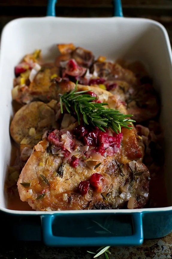 Pork Chops with Cranberries and Leeks from Cookin' Canuck, shown in serving dish.