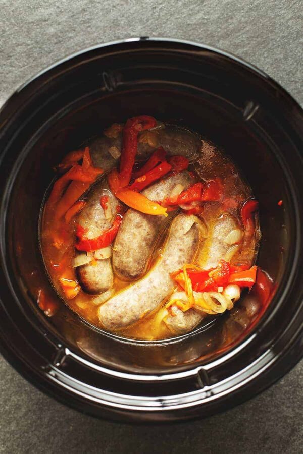 https://www.slowcookerfromscratch.com/wp-content/uploads/2022/01/crock-pot-sausage-and-peppers-51-e1665244235608.jpeg