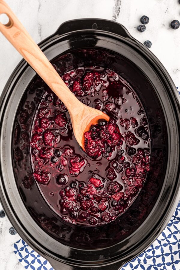 Slow Cooker Warm Berry Compote shown in slow cooker from The Magical Slow Cooker.