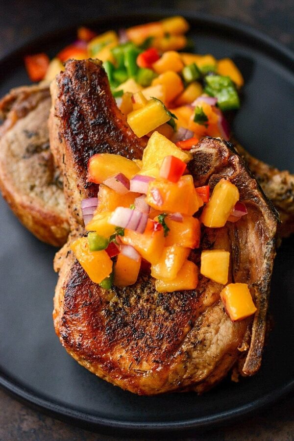 Slow Cooker Pork Chops with Peach Salsa from Slow Cooker Gourmet shown on plate.