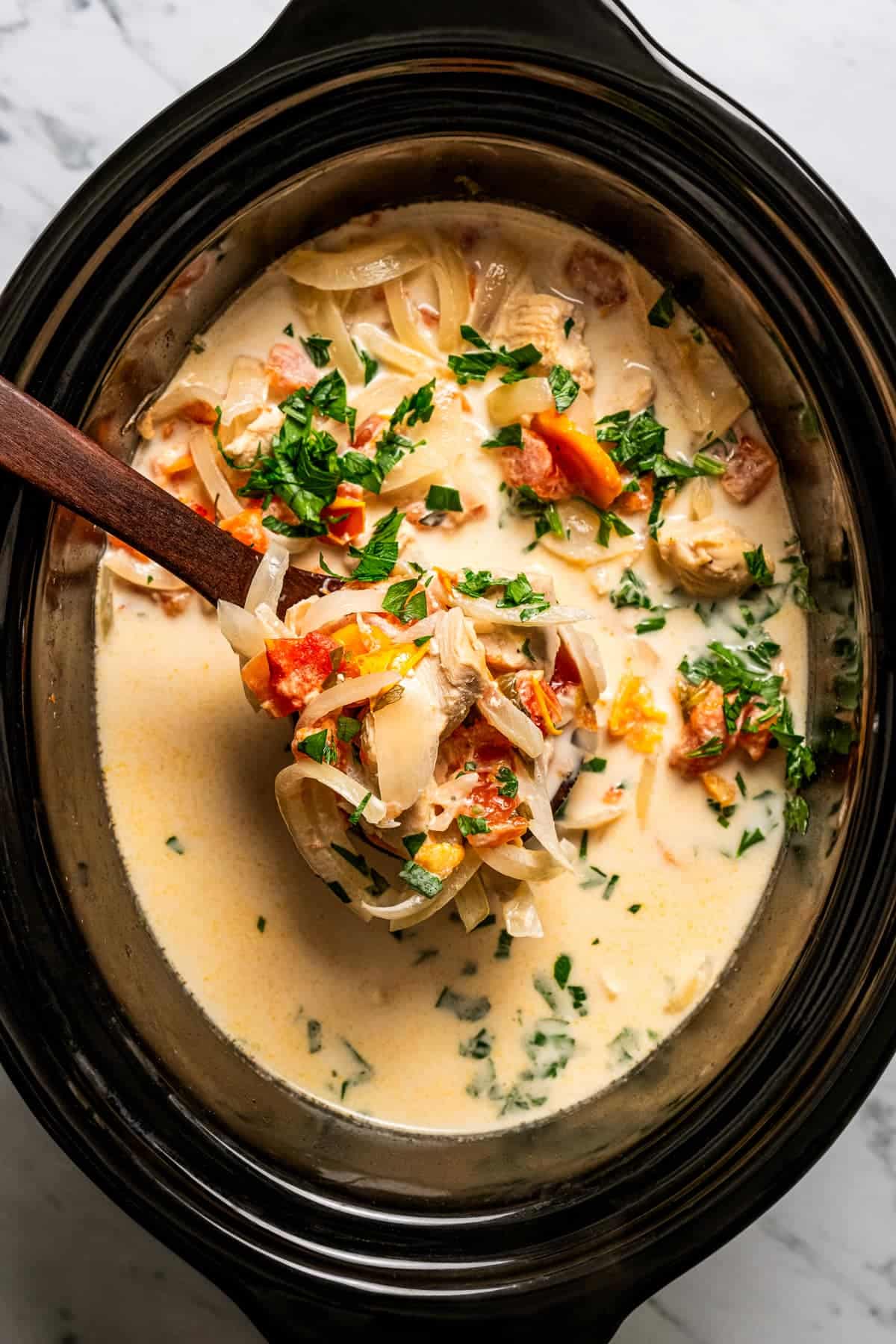 Slow Cooker Creamy Chicken Pasta shown in slow cooker.