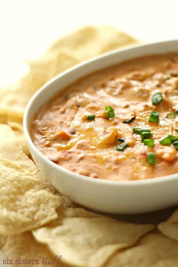 Slow Cooker Warm Chili Cheese Dip from Six Sisters' Stuff shown in slow cooker.
