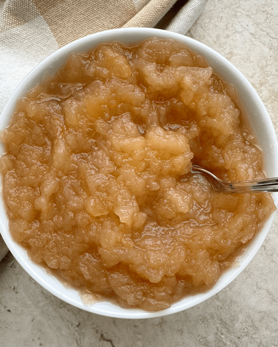Slow Cooker Unsweetened Applesauce from Fit Slow Cooker Queen shown in large serving bowl.