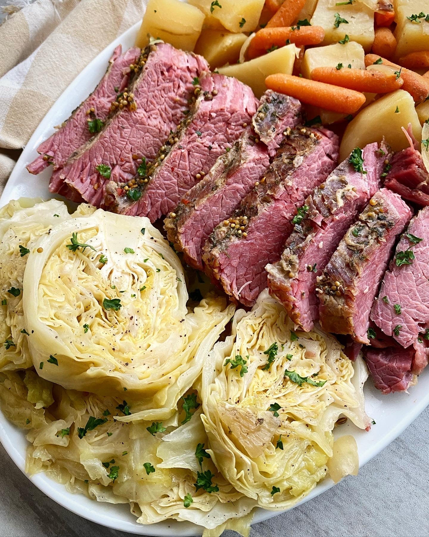Slow Cooker Corned Beef from Fit Slow Cooker Queen shown on serving platter.