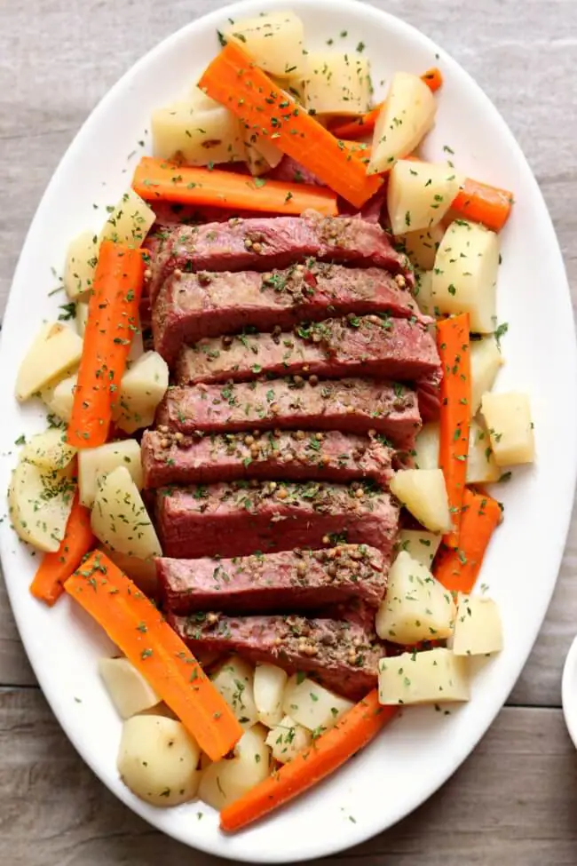 Instant Pot Corned Beef Dinner shown on serving plate.